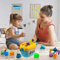 Baby Shape Sorter Block Set with Carry Handle - Market FindsMarket Findsbaby shape sorter block set with colorful geometric pieces played by toddler and mother