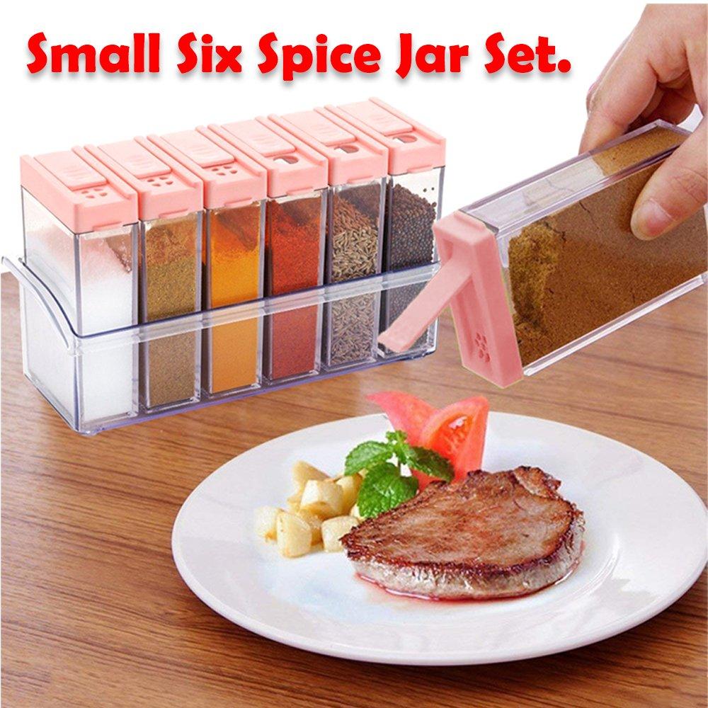 Wukusy plastic spice jar set with six containers and pink lids beside a steak plate