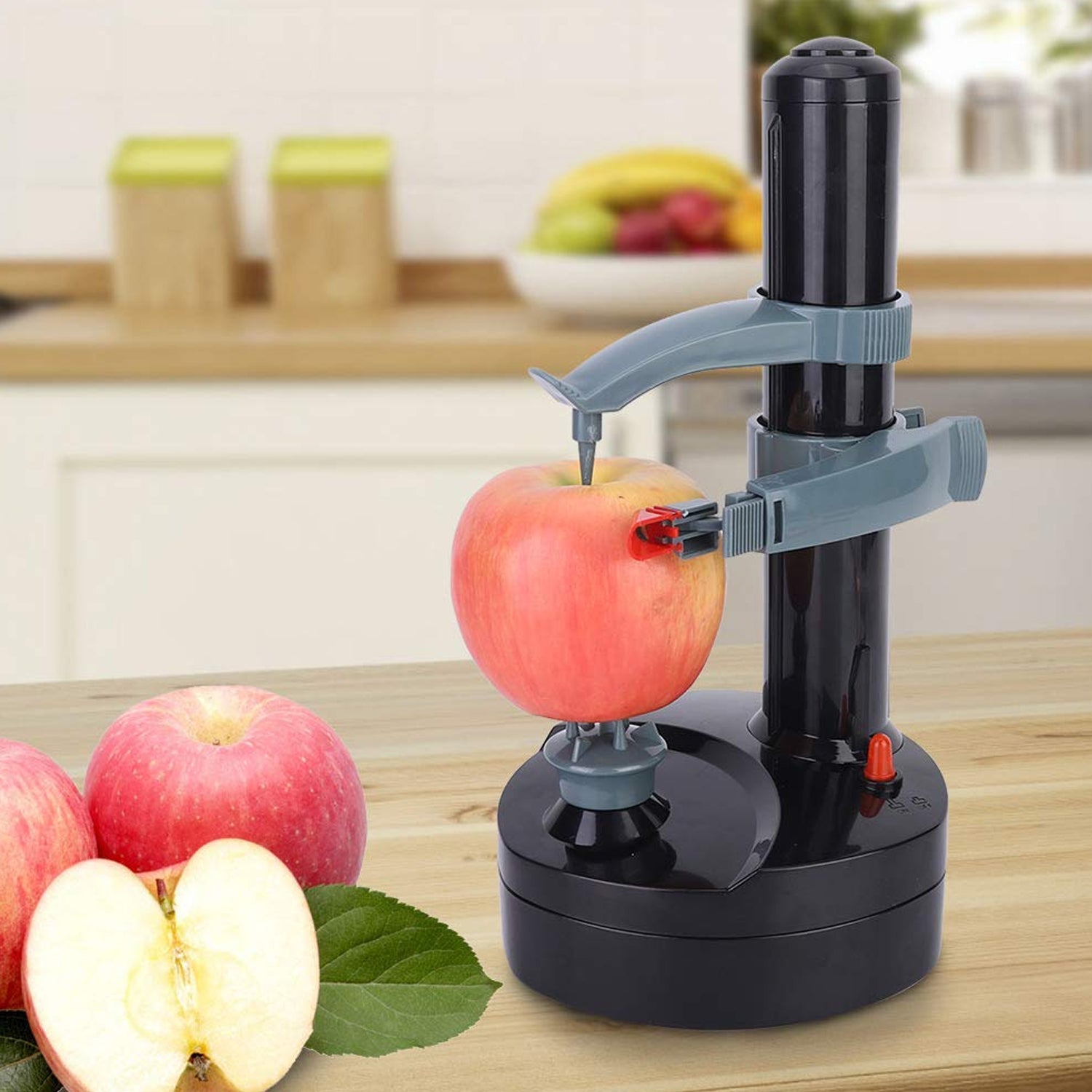 Electric Vegetable Peeler for Easy Home Use - Market FindsMarket Findselectric vegetable peeler peeling a red apple on a wooden kitchen countertop