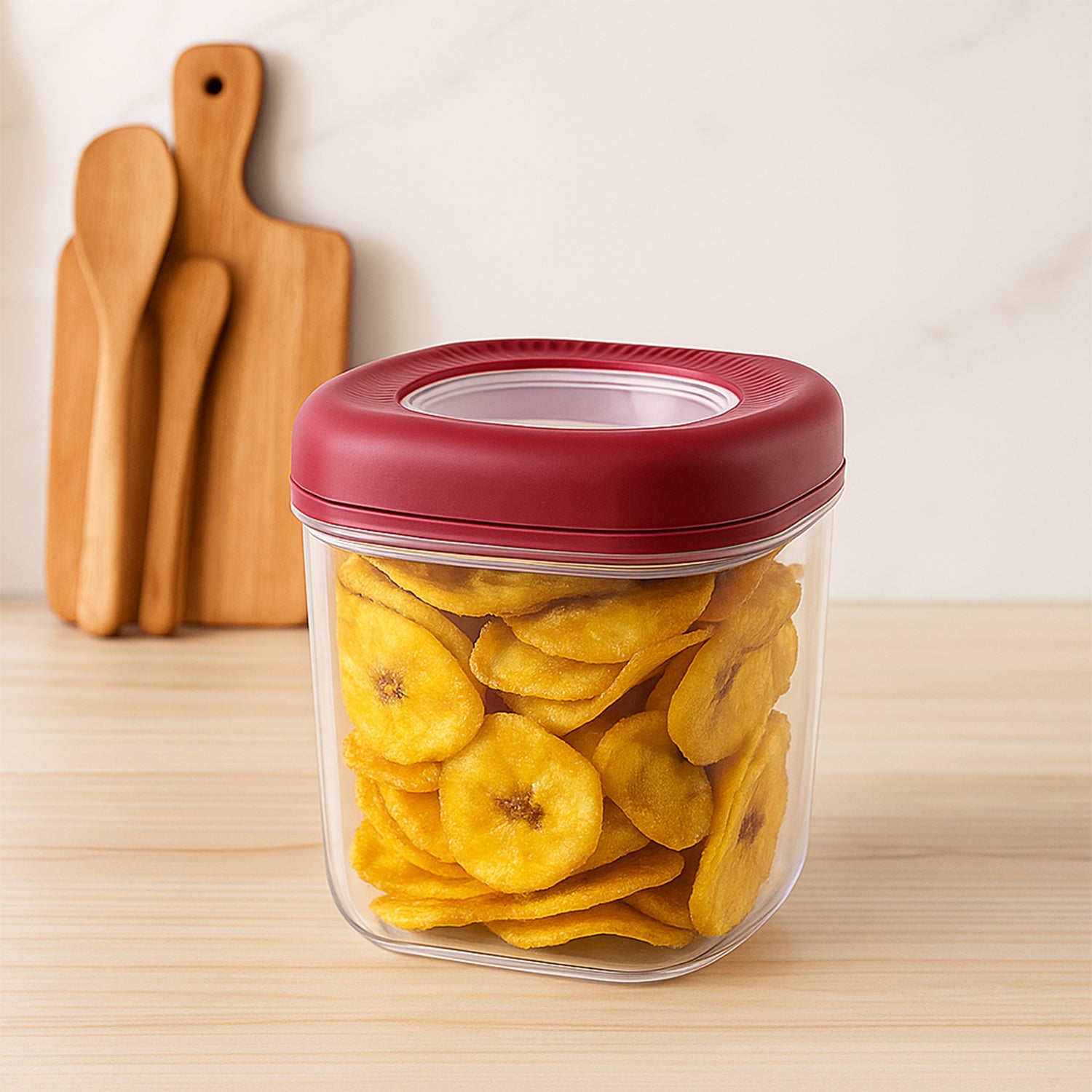 Wukusy transparent kitchen container set with red lid holding dried plantain chips on wooden countertop