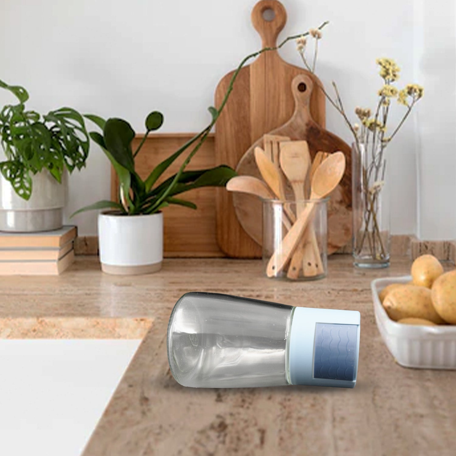 Wukusy glass salt bottle set on kitchen countertop with wooden utensils and plants in background