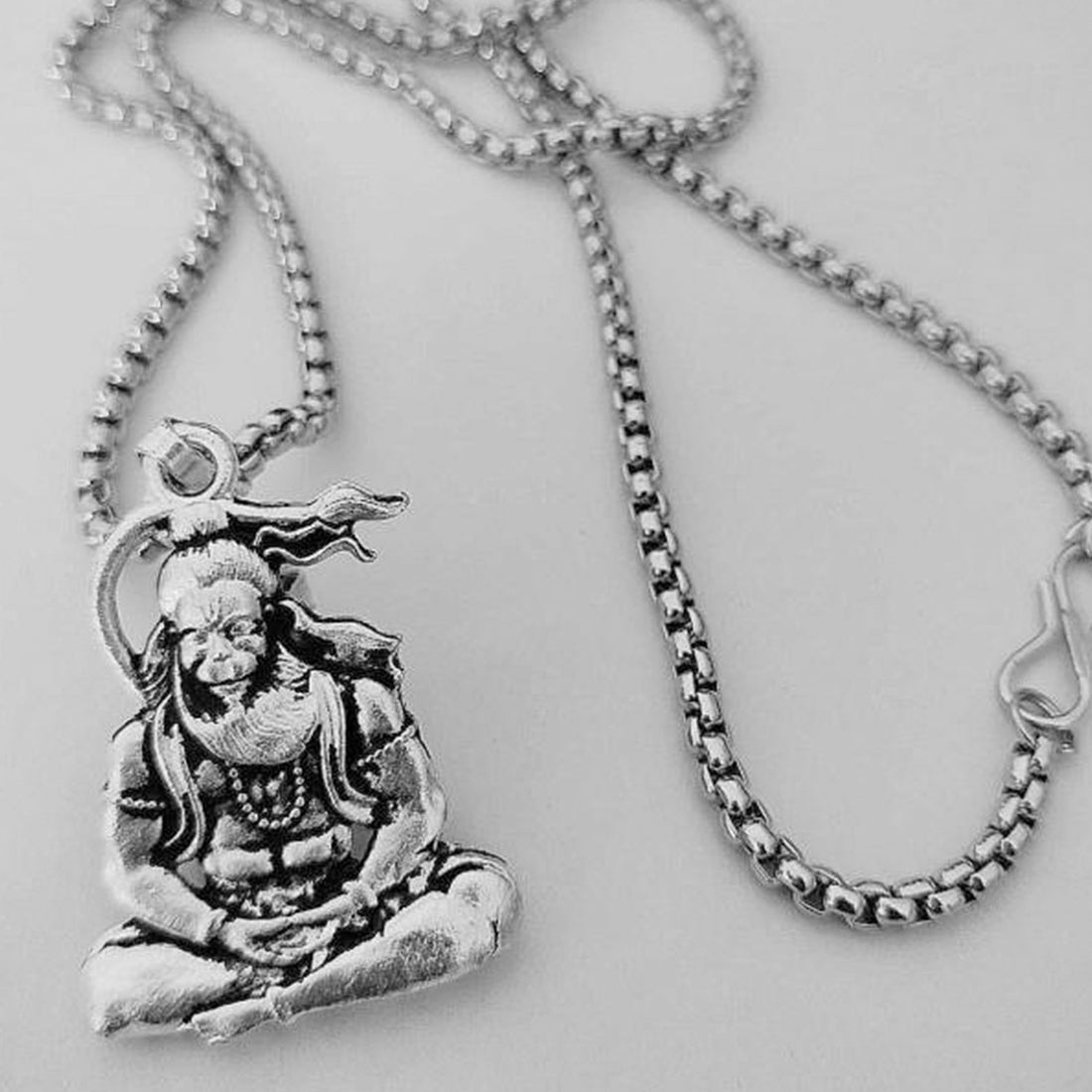 Wukusy Hanuman ji pendant for men silver bracelet featuring detailed deity design on rocky background
