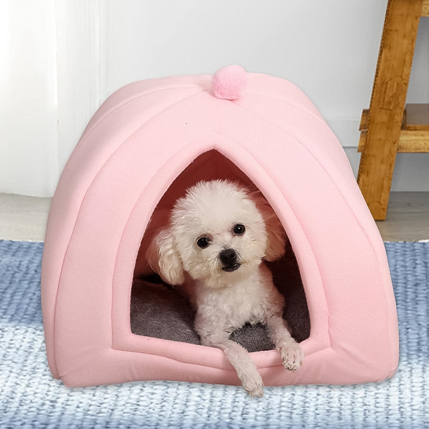 Wukusy luxury pet tent bed in pink with a small white dog resting inside on a gray cushion