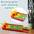 mini finger football game for kids with colorful bowling game design on wooden table
