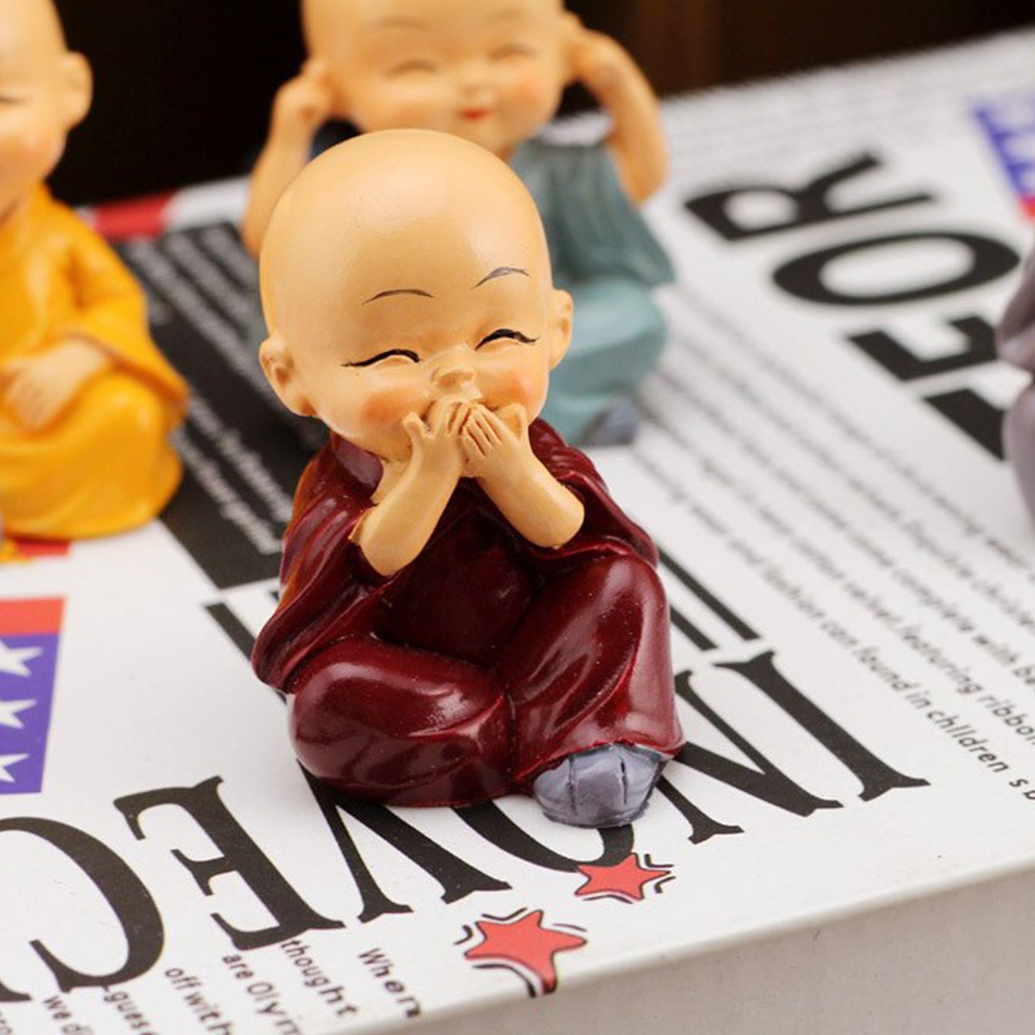 Miniature Buddha Decor for Car Dashboard Set - Market FindsMarket Findsminiature Buddha decor for car dashboard showing a small happy monk figurine in maroon robe