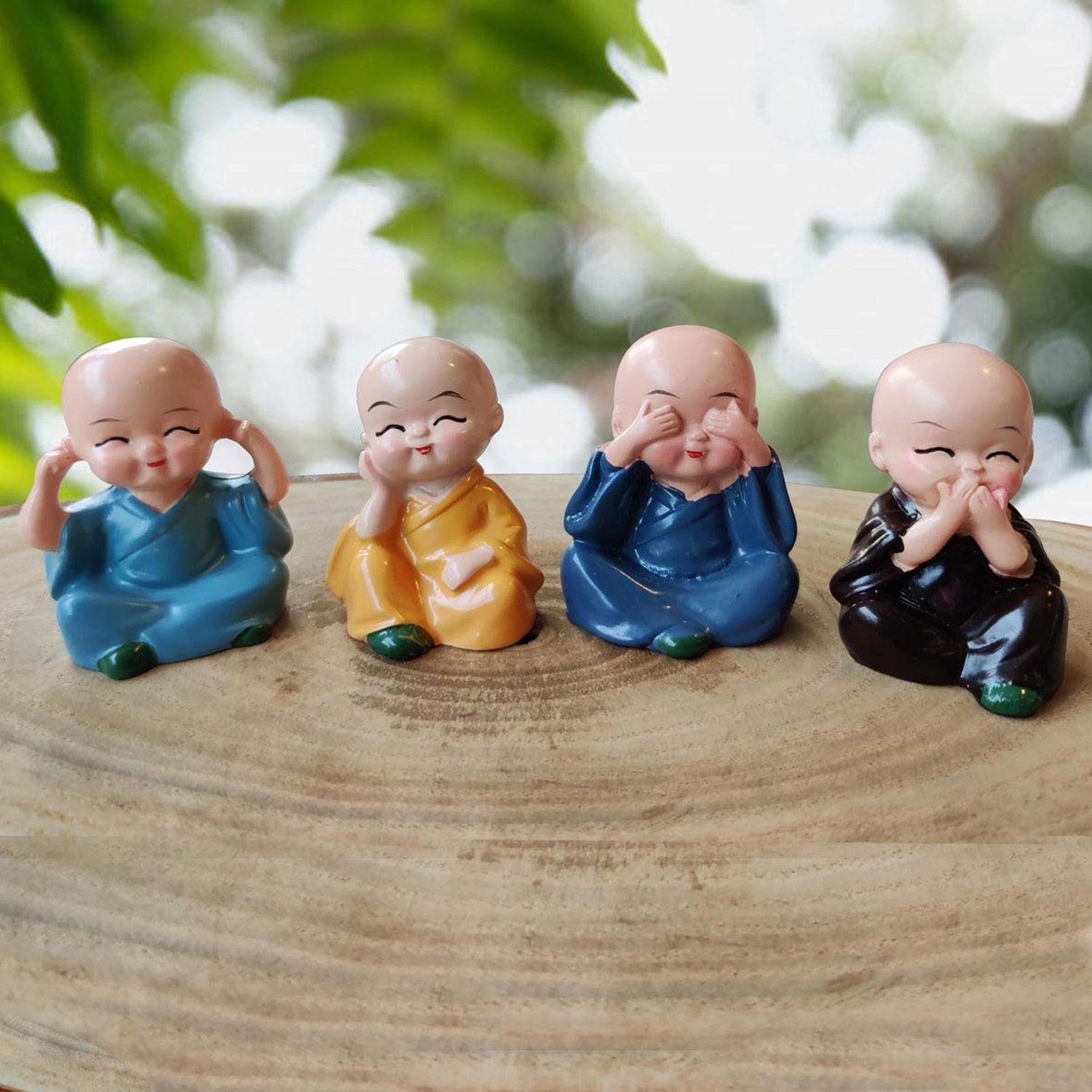 Miniature Buddha Decor for Car Dashboard Set - Market FindsMarket Findsminiature Buddha decor for car dashboard featuring four colorful meditating monk figurines