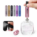 Wukusy mini refillable perfume spray bottle in various colors being filled from a perfume bottle