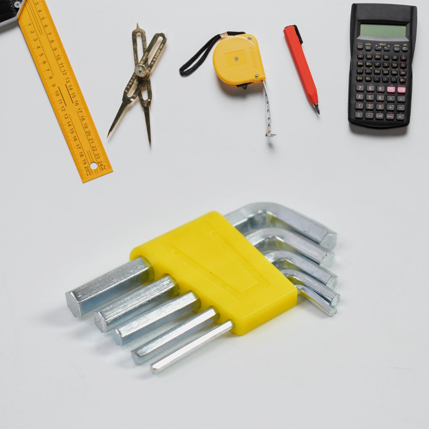 Wukusy multi functional tool set with hex keys, ruler, compass, tape measure, pen, and calculator on white background
