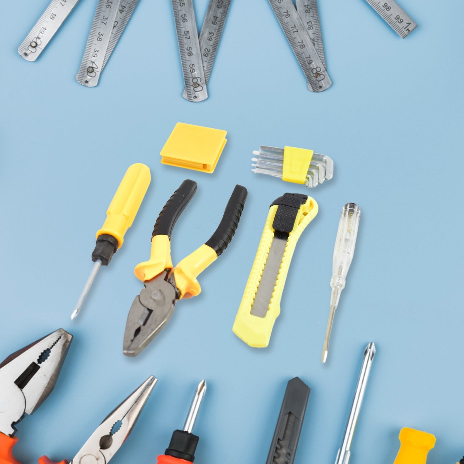 Wukusy multi functional tool set including pliers, screwdrivers, box cutter, and hex keys on blue background