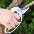 Wukusy professional gardening shears cutting a tree branch with ergonomic handle in garden