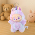 Wukusy light purple plush keychain with pastel colors and cute character design on wooden surface