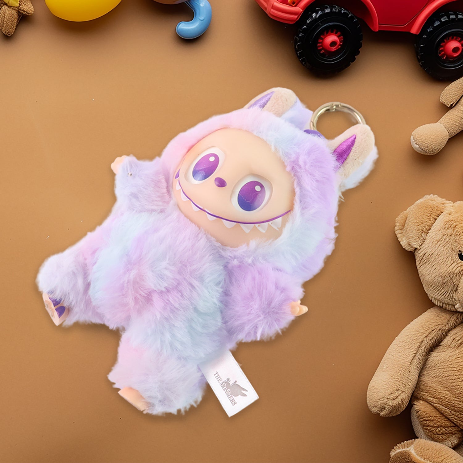 Wukusy light purple plush keychain featuring a cute furry character with big eyes and small ears