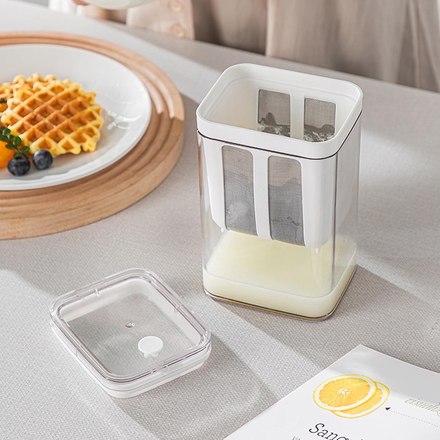 Wukusy 2 in 1 yogurt maker and strainer with transparent container and removable lid on kitchen table