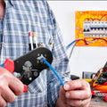 Wukusy wire ferrule kit with crimper being used to crimp a blue wire in an electrical setup