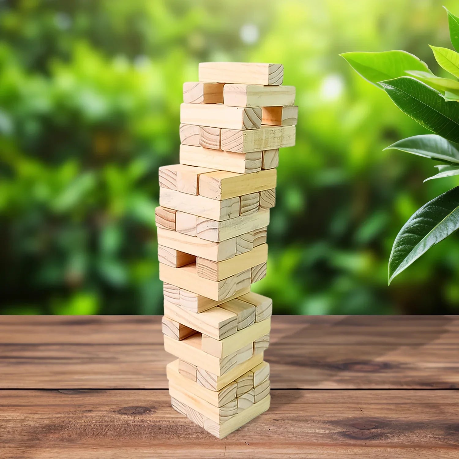 Wooden Stacking Tower Game Classic Blocks - Market FindsMarket Findswooden stacking tower game made of natural wood blocks on wooden table with green background