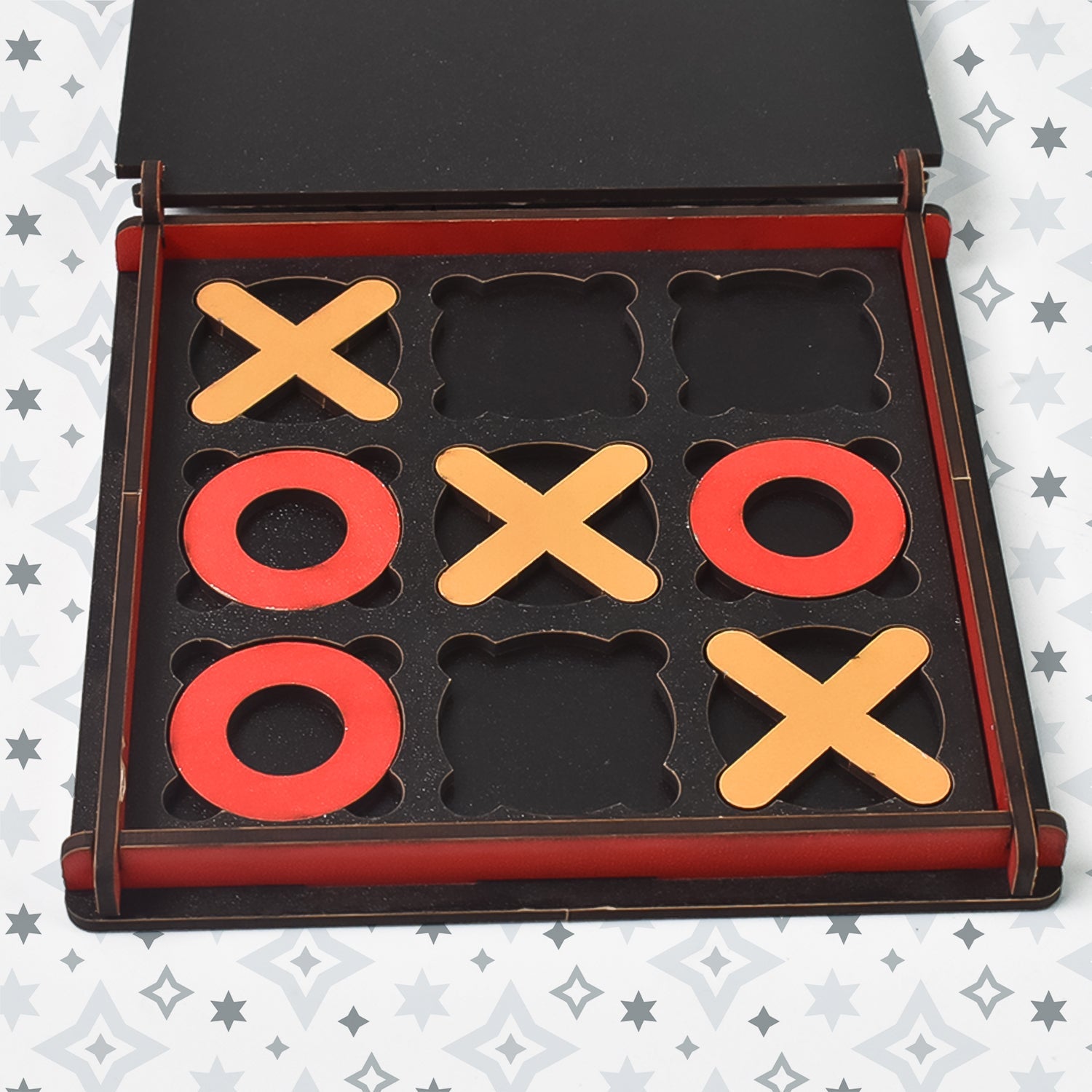 Wukusy wooden tic tac toe game with red and yellow X and O pieces in wooden box